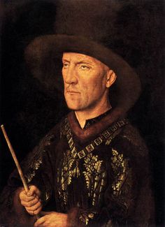 an old man wearing a black hat and holding a stick in his right hand while looking off to the side