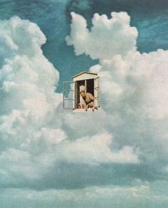 a man is standing in the open window of a box on a cloud filled sky