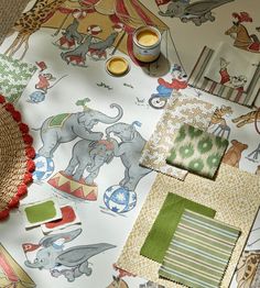 an elephant themed wallpaper is shown with various items on the floor and in front of it