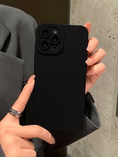 a woman holding up her phone case with the text plain phone case written in arabic