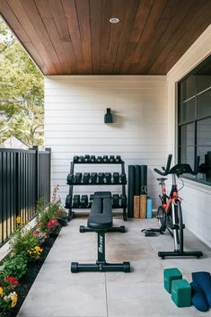 an outdoor gym with exercise equipment and flowers