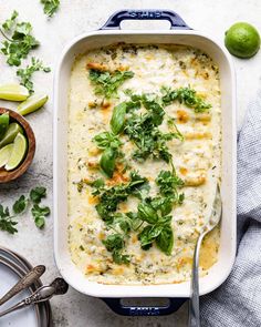 a casserole dish with broccoli and cheese in it on a table