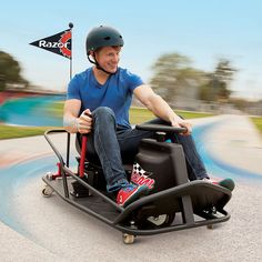 a man riding on the back of a small cart