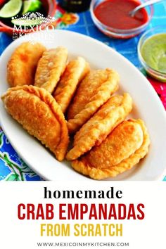 mexican recipe crab empanadas from scratch recipe on a plate with guacamole in the background