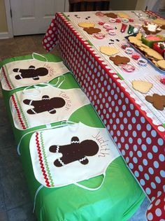 the table is set up with many different desserts on it, including cupcakes and cookies