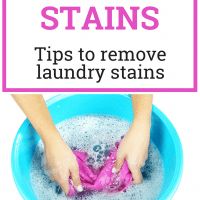 a person washing their hands in a blue bowl with the words tips to remove laundry stains