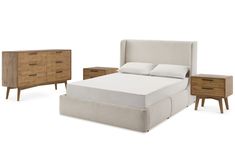 a bed with two nightstands and a night stand next to it on a white background