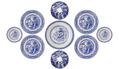 six blue and white plates sitting on top of each other