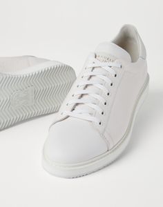 Grained calfskin sneakers These sneakers combine a classic slim and essential design with fine materials and skillful craftsmanship. The refined texture of grained calfskin, featuring an uneven effect, enhances the vintage feel of the shoe. Comfort is guaranteed by a lightweight rubber sole. Luxury Calf Leather Sneakers With Stitched Sole, Elegant Sneakers With Plain Toe And White Sole, Elegant Sneakers With White Sole And Plain Toe, Elegant Low-top Leather Sole Sneakers, Elegant Low-top Sneakers With Leather Sole, Fashionable Sneakers With Contrast Sole And Calf Leather, Elegant Sneakers With Contrast Sole And Calf Leather, Elegant Calf Leather Sneakers With Textured Sole, Elegant Calf Leather Sneakers With Contrast Sole