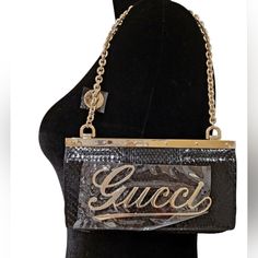 This Rare Gucci Clutch Is Pushing Its Way Into Vintage Status, Featuring A Gold-Tone Gucci Logo At The Front, Embellished With Sparkling Crystals. Made From Mixed Materials Including Python, Leather, And Satin. Gold-Tone Buckle Hardware And Beautiful Chain. Snap Button Fastening At The Flap Closure. Gold-Tone Chain Strap With Logo Disc. Dust Bag, Original Box, And All The Tags Are Included. "Starlight" Met, Black Python, Black Leather, Black Satin And Purple Satin Inside Interior. This Bag Was P Gold Gucci Party Bag, Gucci Party Bags, Gucci Leather Party Bag, Trendy Gucci Evening Bags, Gucci Clutch Bag, Navy Clutch, Black Clutch Bags, Black Python, Gucci Clutch