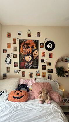 a bedroom with pictures on the wall and stuffed animals