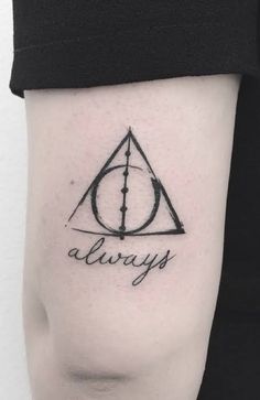 a harry potter tattoo on the left arm and shoulder, with the word always written in cursive writing