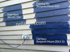 some blue paint is on the side of a house and it's names are painted