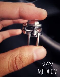 Very cool MF DOOM rapper Madvillain hip hop underground rap legend finger ring jewelry.      ..:On sale special:..             R.I.P MF DOOM The Metal ring is made of zinc alloy.  Surface width, 8mm.  DEAR CUSTOMER'S,PLEASE NOTE, LOOK AT RING SIZE CHART LOCATED IN THE PHOTOS OF THIS LISTING TO COMPARE SIZES TO HELP ORDER THE RIGHT SIZE FOR YOUR FINGER. :) I made the sizes under variations as size 7 thru 14.   The size chart should show you the     inches,circumference, diameter and perimeter(ins Mf Doom Ring, Underground Hip Hop, Mf Doom, Ring Finger, Metal Rings, Band Rings, Rap, Hip Hop, Jewelry Rings