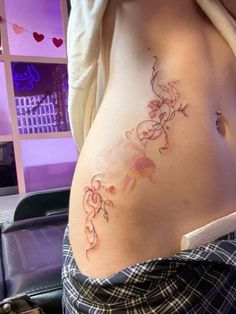 a woman with a tattoo on her stomach