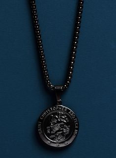 "Black coated Saint Christopher Necklace - Gifts for Him - Black coated Stainless Steel Round Box Chain 3mm - Father's Day Gifts - St. Christopher Medal The name \"Christopher\" means Christ-bearer, and alludes to the legend of the man carrying the Christ Child across the river. St. Christopher is the patron saint of travelers and of children. Chain: Round Box 3mm Clasp: Lobster Chain: Black coated Stainless Steel Pendant: Black coated Stainless Steel Pendant: 24mm diameter Chain: Choose length Black Round Jewelry For Streetwear, Black Stainless Steel Jewelry For Streetwear, Saint Christopher Necklace, St Christopher Necklace, St Christopher Medal, Round Locket, St Christopher, Saint Christopher, Round Box