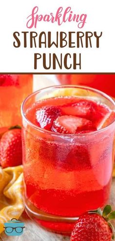 sparkling strawberry punch in a glass with strawberries and lemons on the side for garnish