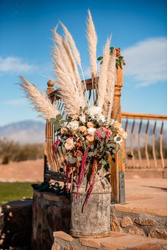 Wedding alter flowers, rustic theme, vintage milk jug. Milk Jug Wedding Decor Rustic, Western Boho Wedding Head Table, Milk Jug Floral Arrangements, Milk Jug Flower Arrangement, Country Western Wedding Table Decor, Western Wedding Altar, Rustic Cowboy Wedding Decor, Boho Western Centerpieces, Cowboy Wedding Flowers