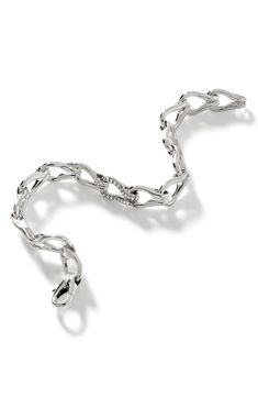 Linked loops of sterling silver compose this handsome chain bracelet highlighted by pavé diamonds at the center. Total diamond weight: 0.18ct. Color: IJ Clarity: I1 Sterling silver/diamond Imported >Diamond Guide Silver Diamond Chain Bracelets, Silver Diamond Link Bracelet, Silver Chain Link Diamond Bracelet For Formal Occasions, Silver Diamond Link Bracelet With Jubilee Style, Modern Silver Diamond Chain Bracelet, Formal Silver Chain Link Diamond Bracelet, White Gold Chain Diamond Bracelet, White Gold Diamond Jubilee Bracelet, Luxury Sterling Silver Chain Bracelet With Diamond Accents