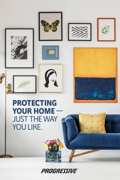 a blue couch sitting in front of a white wall with pictures on it and the words protecting your home just the way you like