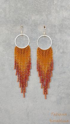 These handmade unique earrings are made of high-quality Czech beads and strong synthetic thread. They are elegant, fashionable, and highly versatile, suitable for everyday wear. Color: brown, orange,gold. 100% hand made with love! Measurements: Length-about  12.5cm (5 inch) Width -about  2.5 cm (1 inch) Materials: Sterling silver hook Czech glass beads Nylon Thread Cheap Orange Beaded Earrings, Brown Dangling Bead Earrings, Handmade Brown Dangle Hoop Earrings, Handmade Brown Dangle Chandelier Earrings, Brown Dangle Earrings With Colorful Beads, Brown Beaded Dangle Tassel Earrings, Brown Dangle Chandelier Earrings With Beads, Chandelier Boho, Seed Bead Jewelry Patterns