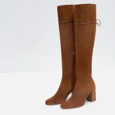 Material: These knee-high boots are crafted from soft and luxurious tan suede, ensuring comfort and style. Back Lace-Up Design: The boots feature a unique back lace-up design, allowing for a customized and secure fit while adding a trendy touch to your outfit. Chunky Heel: With a sturdy chunky heel, these boots offer both elegance and stability, making them suitable for extended wear. Knee-High Length: These boots reach up to the knee, providing extra warmth during colder seasons while adding a High Heel Leather Boots, Boots With Laces, Heel Knee High Boots, Real Leather Boots, Leather High Heel Boots, Zara Boots, Custom Boots, High Heel Boots Knee, Suede Boots Knee High