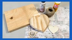 some crafting supplies are laying out on a table with the words love spelled in front of them