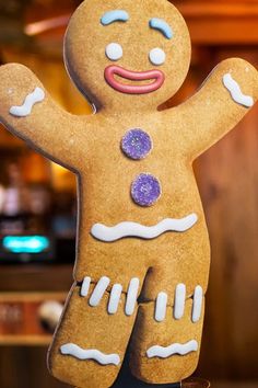 there is a ginger man made out of cookies on the table in front of a bar