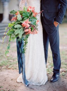 a bride and groom standing next to each other