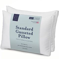 two pillows sitting next to each other with the words standard gusted pillow on them