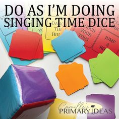 the words do as i'm doing sing - time dices are surrounded by colored paper