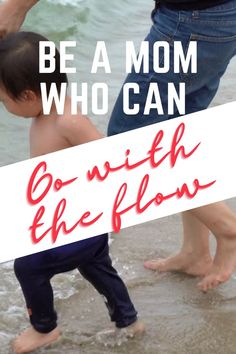 a young boy standing on top of a beach next to the ocean with text overlay that reads, be a mom who can go with the flow