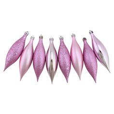 pink christmas ornaments are lined up against a white background, with silver tips on each ornament