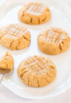 peanut butter cookies on a white plate with a spoon