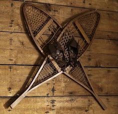 an image of a pair of skis that are on a wooden floor with the words snowshoes written below it