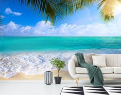 a beach scene with palm trees and the ocean wallpaper mural in an open living room