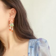 Style: Retro Material: Others Color: Peach Jade Flower Tassel Ear Studs Orange Tassel Drop Earrings As Gift, Orange Tassel Drop Earrings, Orange Tassel Drop Earrings For Gift, Orange Beaded Earrings For Summer, Elegant Orange Beaded Earrings For Summer, Bohemian Orange Jewelry For Spring, Orange Drop Earrings For Spring, Orange Earrings For Spring Gift, Spring Gift Orange Earrings