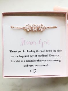 a pink box with a bracelet in it that says, flower girl thank you for leading the way down the aisle on the happy day of our lives