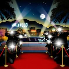 three black bears sitting in front of a car on a red carpet with hollywood lights