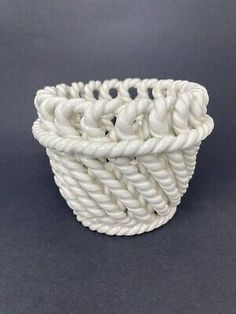 a white rope basket on a gray background