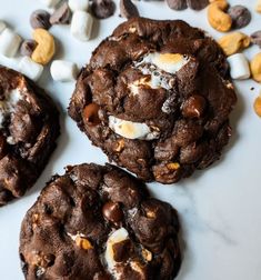 three cookies with marshmallows and chocolate chips