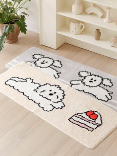 two rugs with sheep and cake on them