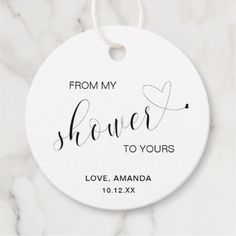 a white ceramic ornament with the words from my shower to yours