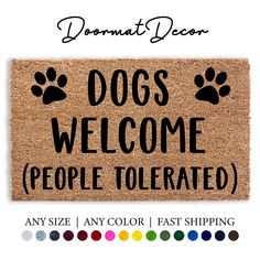 a door mat with the words dogs welcome people tolerrated and paw prints on it