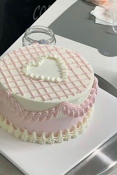 a heart shaped cake sitting on top of a white plate