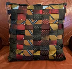 a cushion made out of ties on a couch