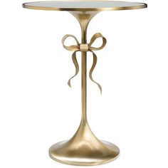 a gold table with a bow on it and a glass top that is sitting on a white background