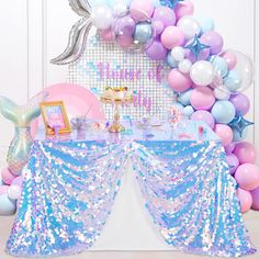 a mermaid themed birthday party with balloons and decorations