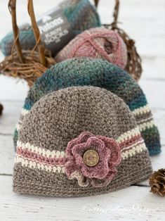 three crocheted hats sitting next to each other