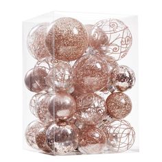 a clear box filled with lots of shiny christmas bauble ornament balls